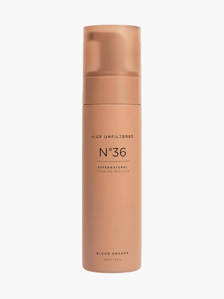 + Lux Unfiltered N°36 Supernatural Tanning Mousse in branded bottle component on a light gray background